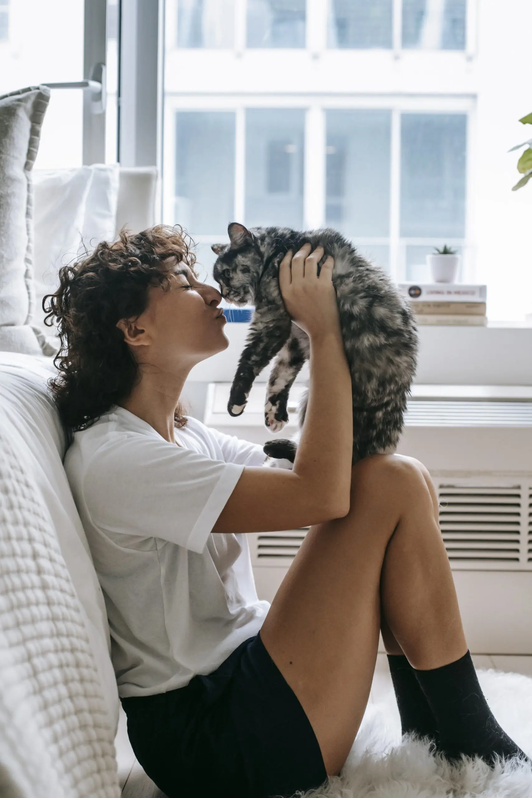 Lady playing with cat