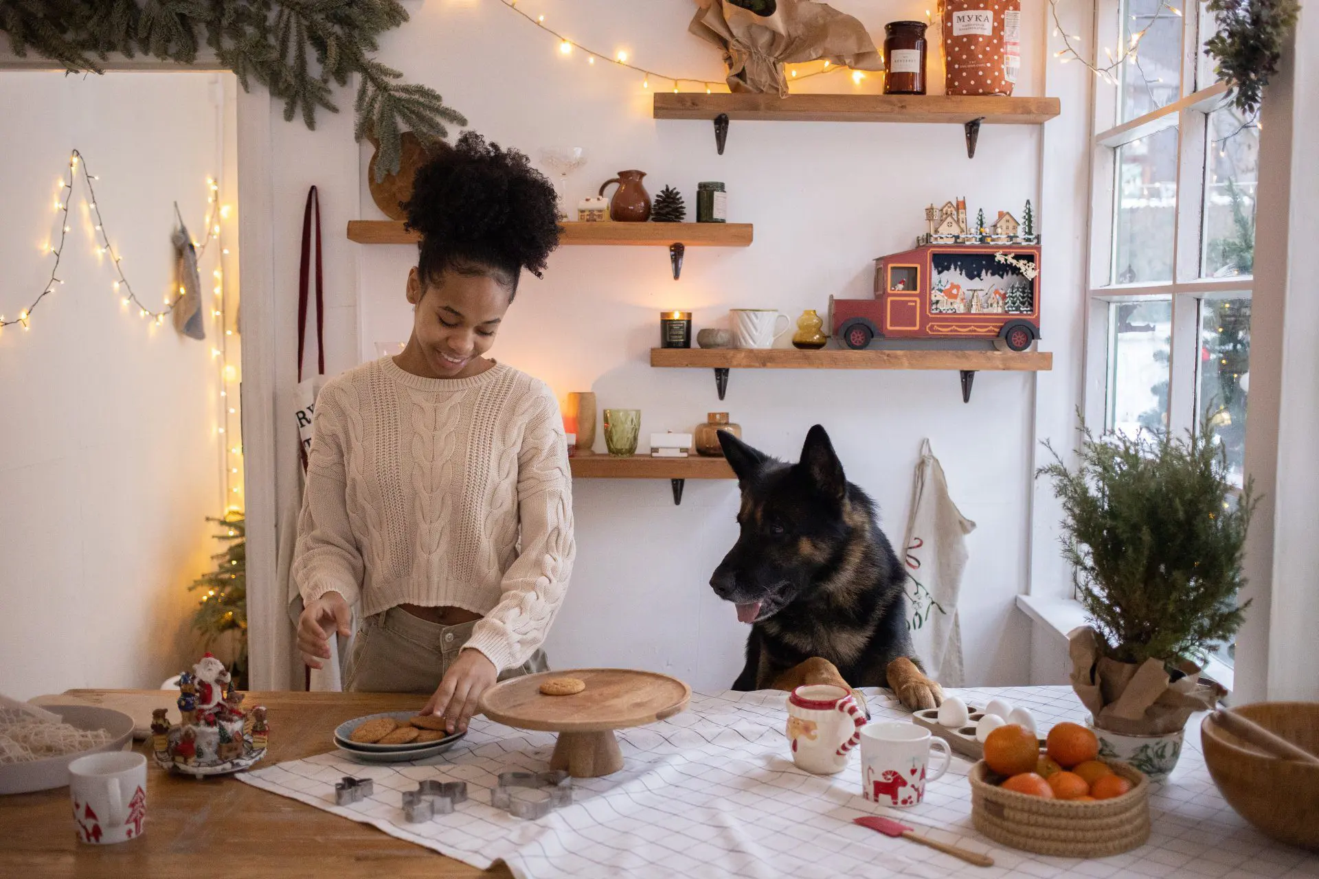 Girl and dog making cookies